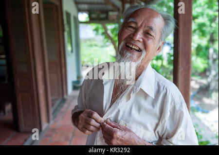 Portrait of a lively 89-year-old Vietnamese man in the Mekong delta near Vinh Long in the Mekong delta. Stock Photo