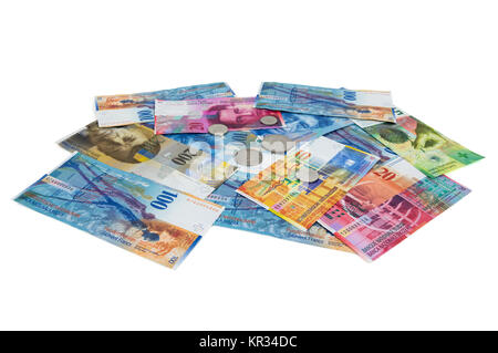 heap of swiss franc banknotes and coins on white background Stock Photo