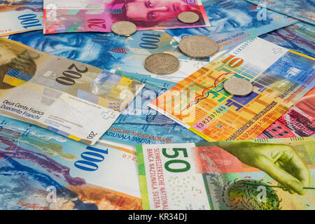 swiss franc banknotes and coins as background Stock Photo