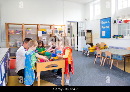 Group of Children Playing in a Classroom Stock Photo