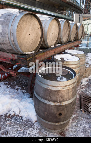 Old fermenting barrels in a backstreet of the historic Gooderham and Worts distillery district now a tourist, arts and shopping destination in Toronto Stock Photo