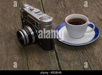 still life the old camera and coffee, on a table Stock Photo