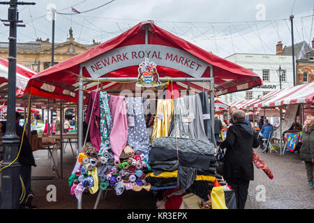 A textiles stall in the market square, Newark-on-Trent, Nottinghamshire, England, UK Stock Photo