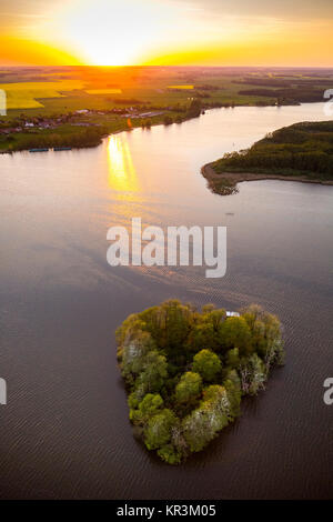 The Muritz with heart-shaped island and residential boat and pleasure boat in the sunset, Vipperow, Mecklenburg Lake District, Mecklenburg Lake Distri Stock Photo