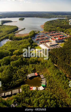 Marina holiday home Hafendorf Rheinsberg, lighthouse in the harbor, port houses, cottages with jetty at the Great Rheinsberger See, Rheinsberg, Meckle Stock Photo