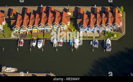 Marina holiday home Hafendorf Rheinsberg, lighthouse in the harbor, port houses, cottages with jetty at the Great Rheinsberger See, Rheinsberg, Meckle Stock Photo