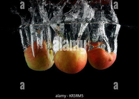 Three apples in water Stock Photo