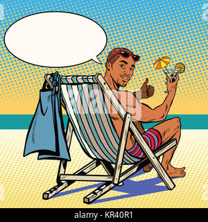 Handsome black man resting on the beach Stock Photo