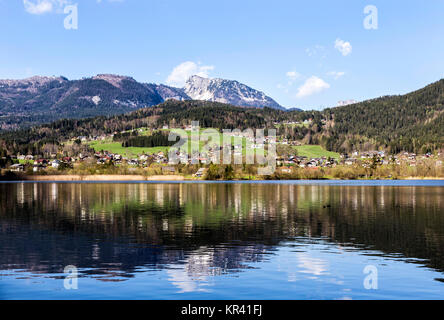 reflection of mountain village in hallstatt lake,austria,europe Stock Photo