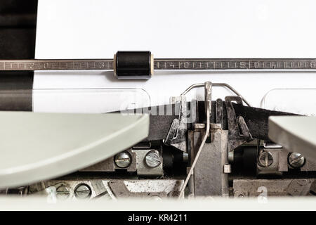 typebar types ink ribbon in mechanical typewriter Stock Photo