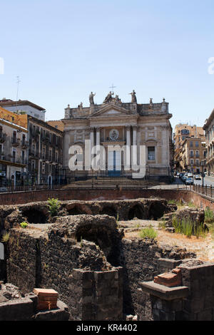 View of Roman Amphitheater of Catania  and Church of San Biagio near Piazza Stesicoro.  It was built around 300 BCE. Stock Photo