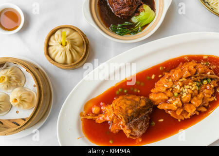 Traditional Shanghai food including dumplings, stewed meatball and mandarin fish Stock Photo