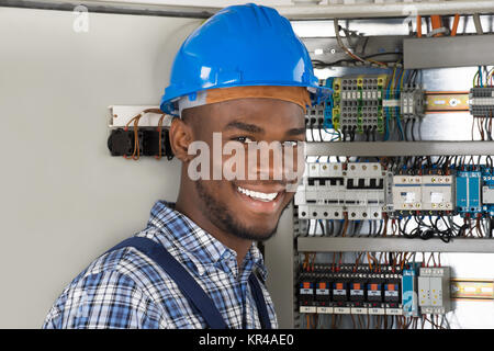 Male Technician Holding Clipboard Stock Photo