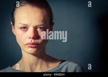 Young woman suffering from severe depression/anxiety/sadness Stock Photo