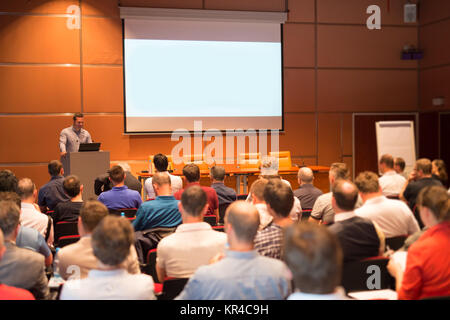 Business speaker giving a talk in conference hall. Stock Photo