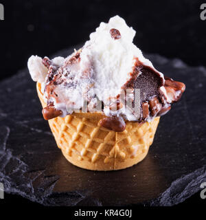 Ice cream over black stone Stock Photo