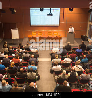 Business speaker giving a talk in conference hall. Stock Photo