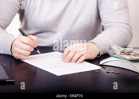 Business adviser analyzing financial figures denoting the progress in the work of the company Stock Photo