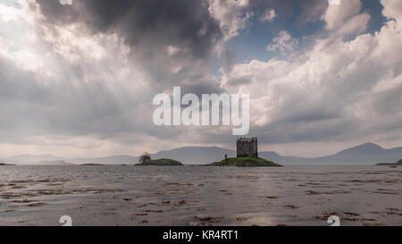 Castle Stalker, also known as The Castle of Aaaaarrrrrggghhh from Monty Python and the Holy Grail, a traditional clan castle stands on a small coastal Stock Photo