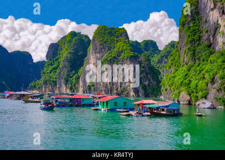 Floating village near rock islands in Halong Bay Stock Photo