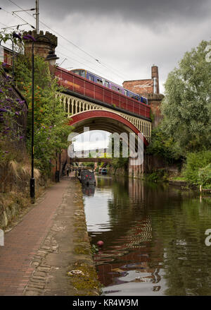 Manchester, England, UK - August 2, 2015: A Northern Rail Class 150 diesel passenger train crosses the Bridgewater Canal at Deansgate in central Manch Stock Photo