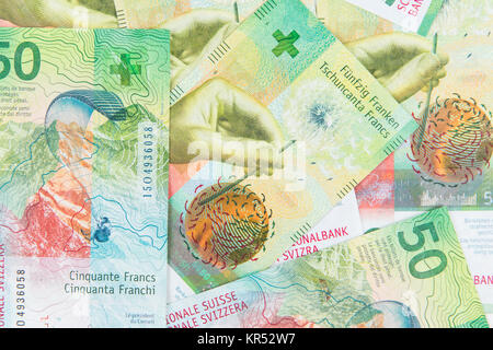 New fifty Swiss Franc banknote as background or wallpaper. 50 CHF notes. Money texture or pattern Stock Photo