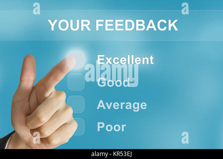 business hand pushing your feedback button Stock Photo