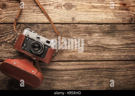 Old vintage camera on the wooden background horizontal Stock Photo