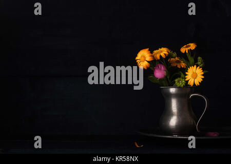 Bouquet of flowers in the old metal jug horizontal Stock Photo