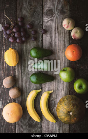Different fruit on the wooden table top view Stock Photo