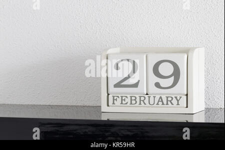 White block calendar present date 29 and month February on white wall background Stock Photo