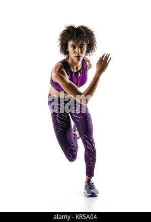 Strong athletic afro woman running over black background Stock Photo - Alamy