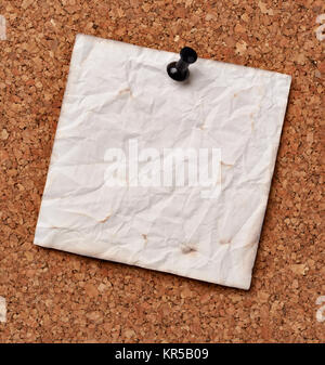 close up of note papers on a cork board Stock Photo
