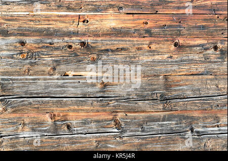 Old natural brown cabin wood wall. Wooden textured background pattern. Stock Photo