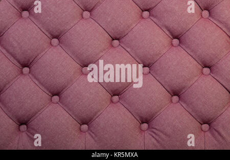 Pink capitone tufted fabric upholstery texture Stock Photo