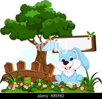 rabbit cartoon posing with blank sign in flower garden Stock Photo