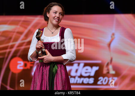 Biathlete Laura Dahlmeier stands onstage during the election to 'Athlete of the year' at the Kurhaus in Baden-Baden, Germany, 17 December 2017. Photo: Uwe Anspach/dpa Stock Photo