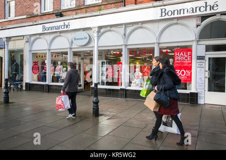 Southport, Merseyside, UK 18th December, 2017. Misty Foggy day for Christmas shopping in Lord Street as last minute shoppers head into the town centre to complete their festive purchases in dark, damp and cold winter weather.  Retailers, in the week before Christmas, are already discounting with pre-Christmas sales to encourage last-minute buying. Stock Photo