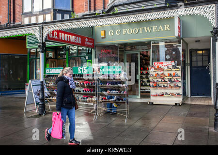 Southport, Merseyside, UK 18th December, 2017. Misty Foggy day for Christmas shopping in Lord Street as last minute shoppers head into the town centre to complete their festive purchases in dark, damp and cold winter weather.  Retailers, in the week before Christmas, are already discounting with pre-Christmas sales to encourage last-minute buying. Credit; MediaWorldImages/AlamyLiveNews. Stock Photo