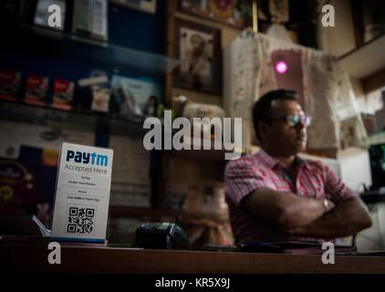 Beijing, India. 12th Apr, 2017. A shop owner collects payment with Paytm, an electronic payment sponsored by China's Ant Financial, in New Delhi, India, April 12, 2017. In recent years, a number of China's technological innovations have been making their moves in the world. Among them, Dockless Shared Bicycles, High-speed Rail, Alipay and E-commerce stand out with a reputation of China's 'four great new inventions' in modern times, which have made the daily life of the public more and more convenient. Credit: Bi Xiaoyang/Xinhua/Alamy Live News Stock Photo