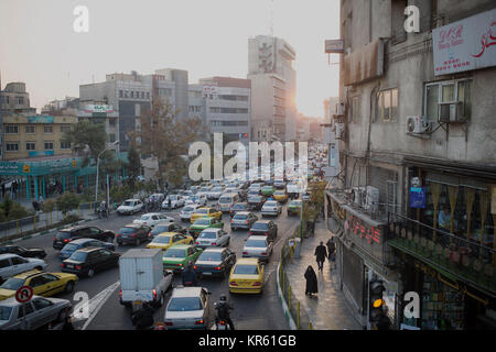 Tehran, Iran. 18th Dec, 2017. Cars are stuck in a traffic jam in air pollution in Tehran, Iran, Dec. 18, 2017. Credit: Ahmad Halabisaz/Xinhua/Alamy Live News Stock Photo