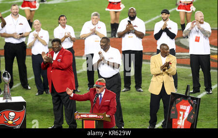 SLP2000012107- 21 JANUARY 2000- EARTH CITY, MISSOURI, USA: Former NFL  players turned broadcasters Howie Long and Marcus Allen meet St. Louis Rams  Kevin Carter after practice at Rams Park, January 21. The