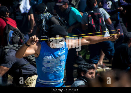 December 18, 2017 - Buenos Aires, Ciudad AutÃ³noma de Buenos Aires, Argentina - A demonstrator takes aim. Protestors from various left-wing groups attacked police after a largely peaceful demonstration outside the nation's Congress buildings. The bill they were protesting''”a revision to the pension system''”became law the following morning. Credit: SOPA/ZUMA Wire/Alamy Live News
