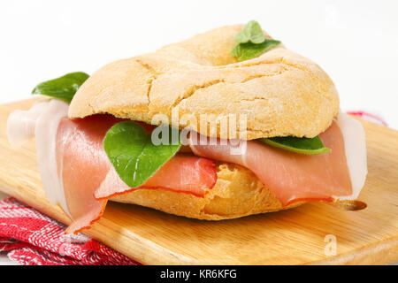 Bread roll (friselle) with slices of Schwarzwald ham Stock Photo