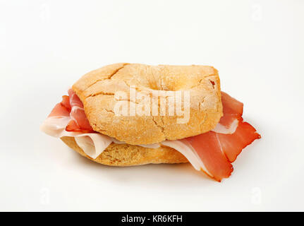 Bread roll (friselle) with slices of Schwarzwald ham Stock Photo