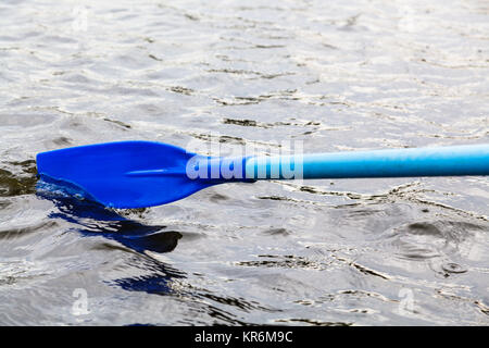 paddle blade in water during boating Stock Photo