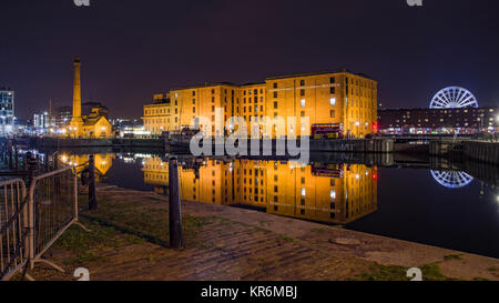 View at Night across the Canning Dock to Hartley Quay showing the Liverpool Maritime Museum Building and the Pump House reflected in the water