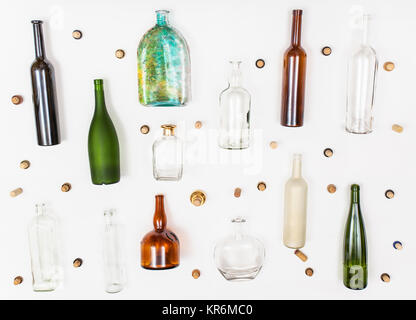 many empty glass bottles and corks on white Stock Photo