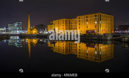 View at Night across the Canning Dock to Hartley Quay showing the Liverpool Maritime Museum Building and the Pump House reflected in the water