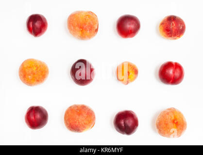 set from ripe nectarines and peaches on white Stock Photo
